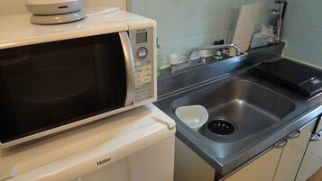 Fridge, microwave, stovetop, cookware/dishes/utensils