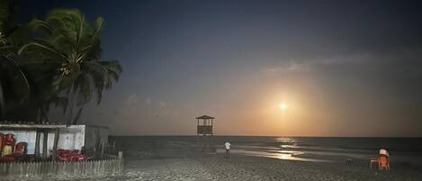 On the beach, sun-loungers
