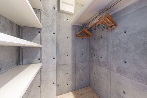 Enjoy a sleek bathroom with a wall-mounted hanger rack for convenient storage.