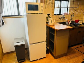 Fridge, microwave, cookware/dishes/utensils