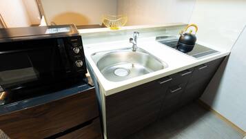 Fridge, microwave, cookware/dishes/utensils, dining tables