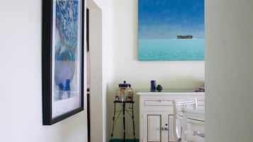 Deluxe Suite | Living area | 32-inch LCD TV with cable channels