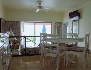 Deluxe Suite | Living area | 32-inch LCD TV with cable channels