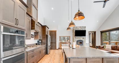 Newly built mountain home with water views, balcony, two kitchens, & W/D