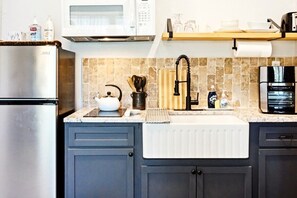 Fridge, microwave, stovetop, coffee/tea maker