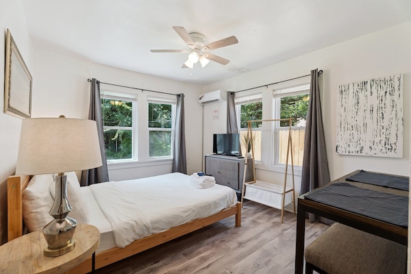 Plush bedding, soft lighting, and charming decor make this a restful retreat.