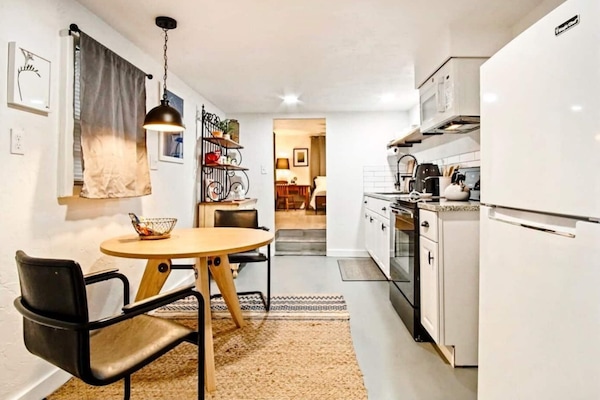 Gather in the cozy living room where every seat invites conversation and relaxation.
