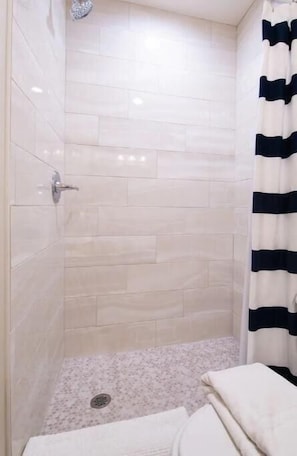 Shower, eco-friendly toiletries, hair dryer, towels