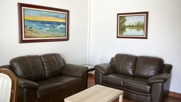 Family Apartment | Living area | 50-inch Smart TV with digital channels, streaming services