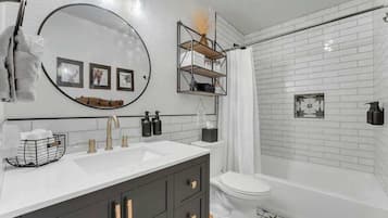 Shower, hair dryer, towels, shampoo