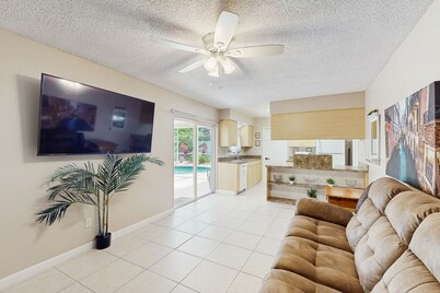 Sun-filled oasis with furnished patio, shared pool, & fire pit - dog-friendly