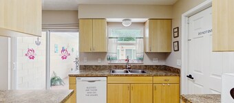 Sun-filled oasis with furnished patio, shared pool, & fire pit - dog-friendly