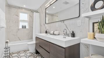 Shower, hair dryer, towels, soap