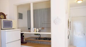 Fridge, microwave, stovetop, cookware/dishes/utensils