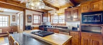 1970s acreage surrounded by trees with deck, grill, & internet