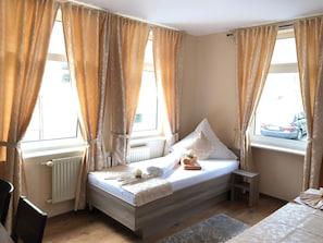 Desk, laptop workspace, blackout curtains, iron/ironing board