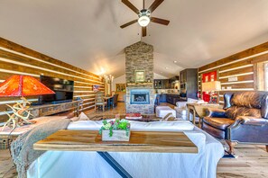TV, fireplace, books - Scenic Ruidoso Escape w/ Hot Tub & Mountain View! (Ruidoso)