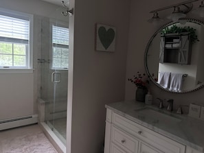 Shower, hair dryer, towels, soap