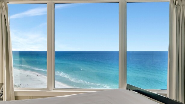 A room with a large window overlooking a beach. - "Serene Sunrises Await: Inviting 14th-Floor 1-Bedroom Retreat in Beachside Two!" at Sandestin Golf and Beach Resort! (Miramar Beach)