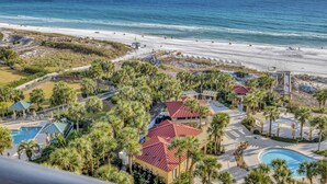 A resort with a pool, palm trees, and a beach view. - "Modern Elegance at Westwinds: Updated 1-Bedroom Condo on the 10th Floor!" at Sandestin Golf and Beach Resort! (Miramar Beach)
