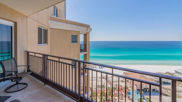A balcony with a view of a beach and ocean. - "15th-Floor Paradise: Recently Updated West-Facing 2-Bed, 2.5-Bath Condo at Westwinds, Sandestin" at Sandestin Golf and Beach Resort! (Miramar Beach)