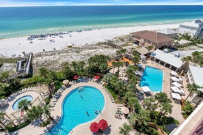 A resort with a large pool, beach access, and a view of the ocean. - "Sunset Splendor: West-Facing 3-Bed, 3-Bath Oasis on the 9th Floor at Westwinds" at Sandestin Golf and Beach Resort! (Miramar Beach)