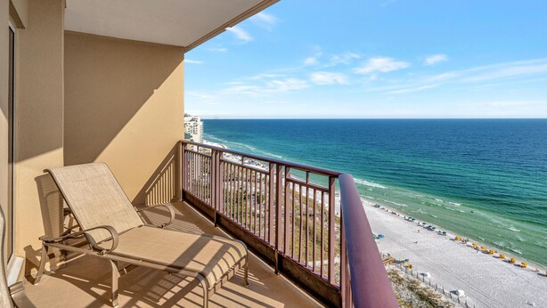 A balcony with two sun loungers overlooking a beach and ocean. - "19th-Floor Elegance: Newly Refurnished 3-Bed, 3-Bath Condo of Westwinds with Sweeping Gulf Views" at Sandestin Golf and Beach Resort! (Miramar Beach)