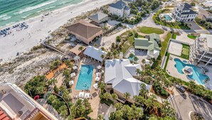An aerial view of a coastal resort with multiple buildings, a beach, and a swimming pool. - "19th-Floor Elegance: Newly Refurnished 3-Bed, 3-Bath Condo of Westwinds with Sweeping Gulf Views" at Sandestin Golf and Beach Resort! (Miramar Beach)