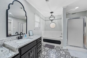 Jetted tub, hair dryer, towels, soap