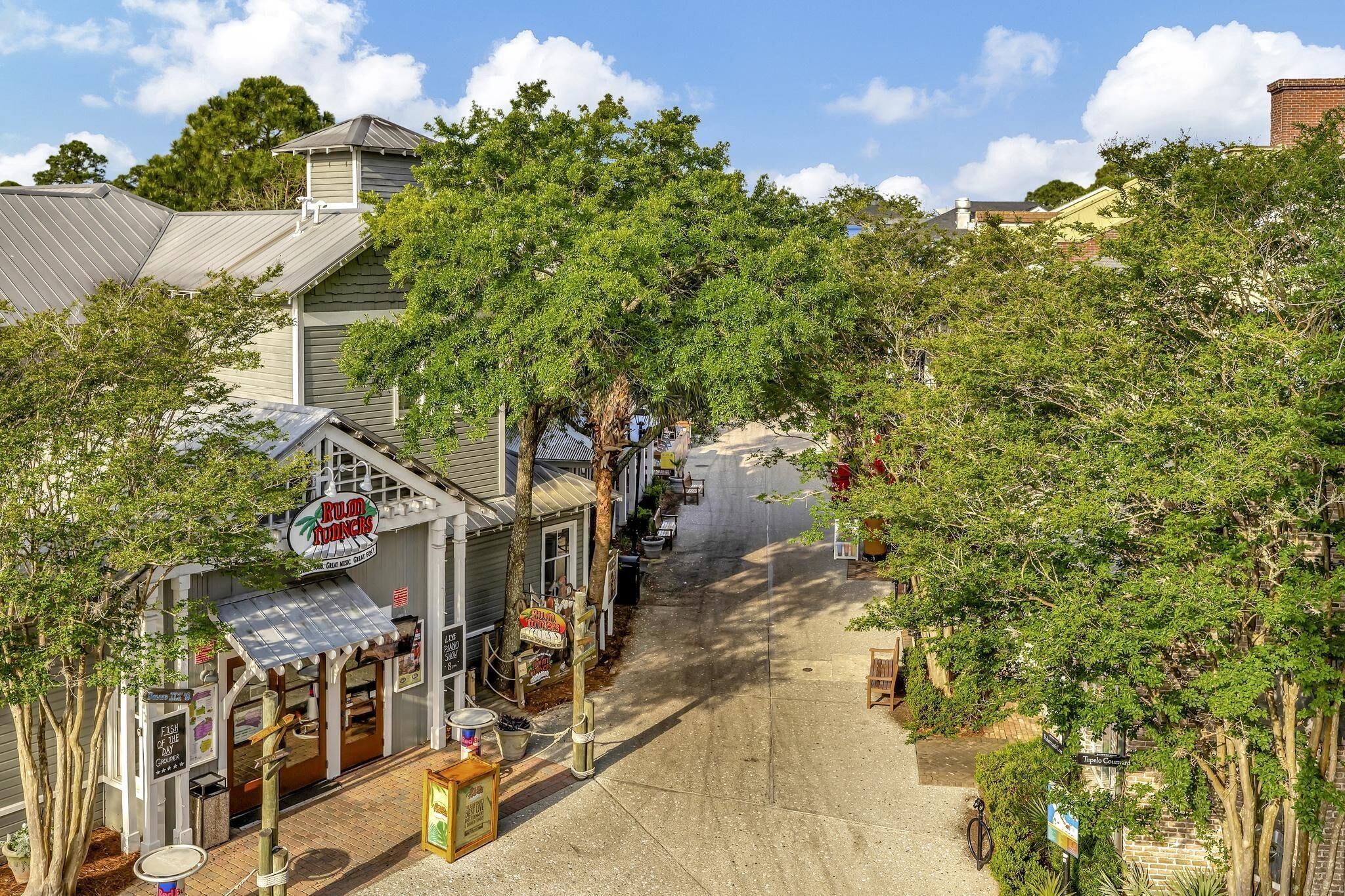 A street view with a restaurant named 'Rudolphs' and a sign for 'The Inn at the Inn'.