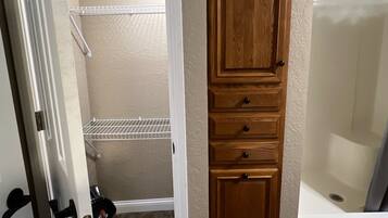 Shower, hair dryer, towels, soap