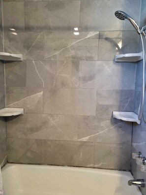 Shower, towels, soap, toilet paper