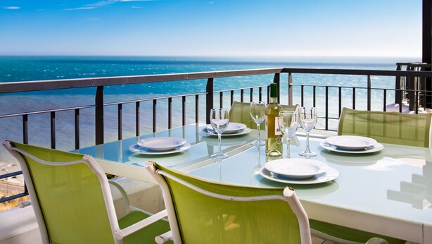 A table set for dining with a view of the ocean. - Lateral View by Interhome (Torrox Costa)