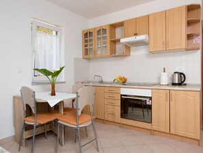 Fridge, oven, toaster, cookware/dishes/utensils