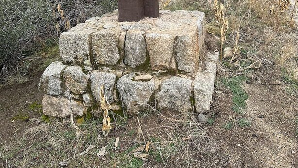A wooden signpost with the text "ENTERING SEQUOIA NATIONAL FOREST" on a stone base. - Cabin Near Sequoia & Kings Canyon National Parks (Dunlap)