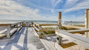 A wooden boardwalk leading to a beach with a clear sky. - Sunny Fort Walton Beach Condo - Walk to Ocean! (Fort Walton Beach)
