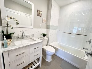 Hair dryer, towels, soap, shampoo