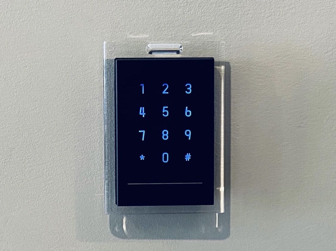 A wall-mounted numeric keypad.