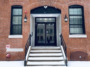 Stunning brick building with a central entrance and traditional architectural style.