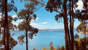 A natural landscape with trees and a body of water. - Hidden on Huon, exclusive getaway (Police Point)