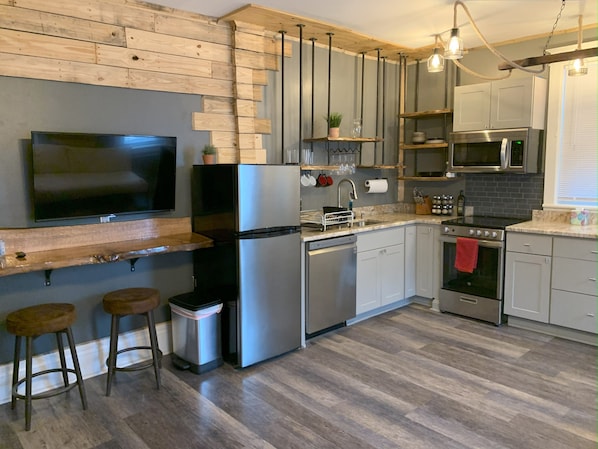 Loft, 2 Bedrooms, River View | Private kitchen | Full-size fridge, microwave, oven, stovetop