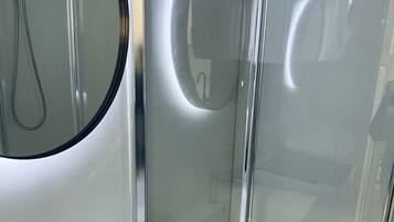 Shower, hair dryer, towels, toilet paper