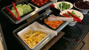 A buffet with various food items including tomatoes, cucumbers, carrots, and salad. - Sera Lake Center Hotel (Akçaabat)