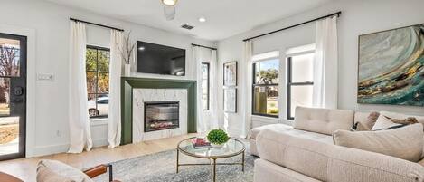 TV, fireplace, books, offices