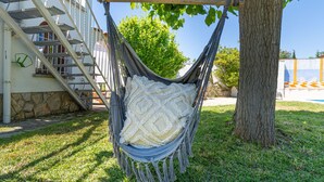 A hammock hanging from a tree, a staircase, and a building with stone walls. - "Holiday Home for 6 with Pool, BBQ, Wifi, Near Beach - Sant Pere Pescador, Costa Brava" (Sant Pere Pescador)