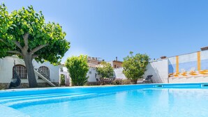 A clear blue swimming pool with a tree and a building in the background. - "Holiday Home for 6 with Pool, BBQ, Wifi, Near Beach - Sant Pere Pescador, Costa Brava" (Sant Pere Pescador)