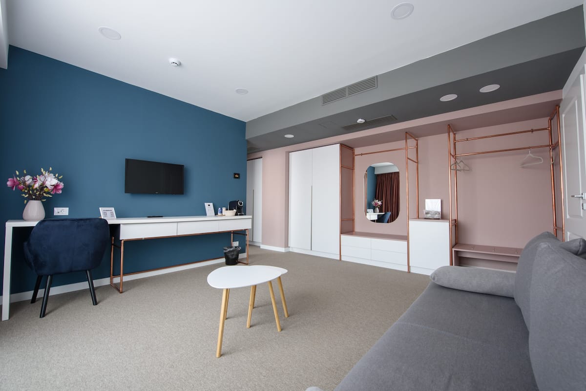 Panoramic Apartment | Living area | 81-cm LED TV with cable channels, Netflix, streaming services