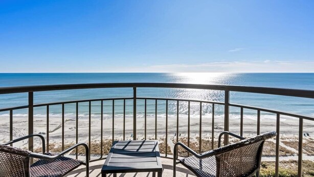 A balcony with a view of the beach and ocean. - Meridian Plaza Unit 1402 - Oceanfront! (Myrtle Beach)