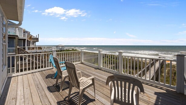 A wooden deck with two chairs and a gazebo overlooking the ocean. - New River Inlet Rd. 1338 (North Topsail Beach)