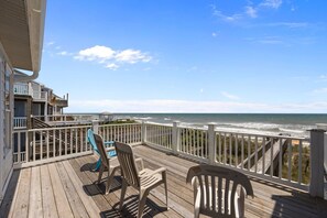 A wooden deck with two chairs and a gazebo overlooking the ocean. - New River Inlet Rd. 1338 (North Topsail Beach)